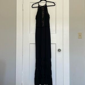 Maxi black halter dress with elegant lacing details.